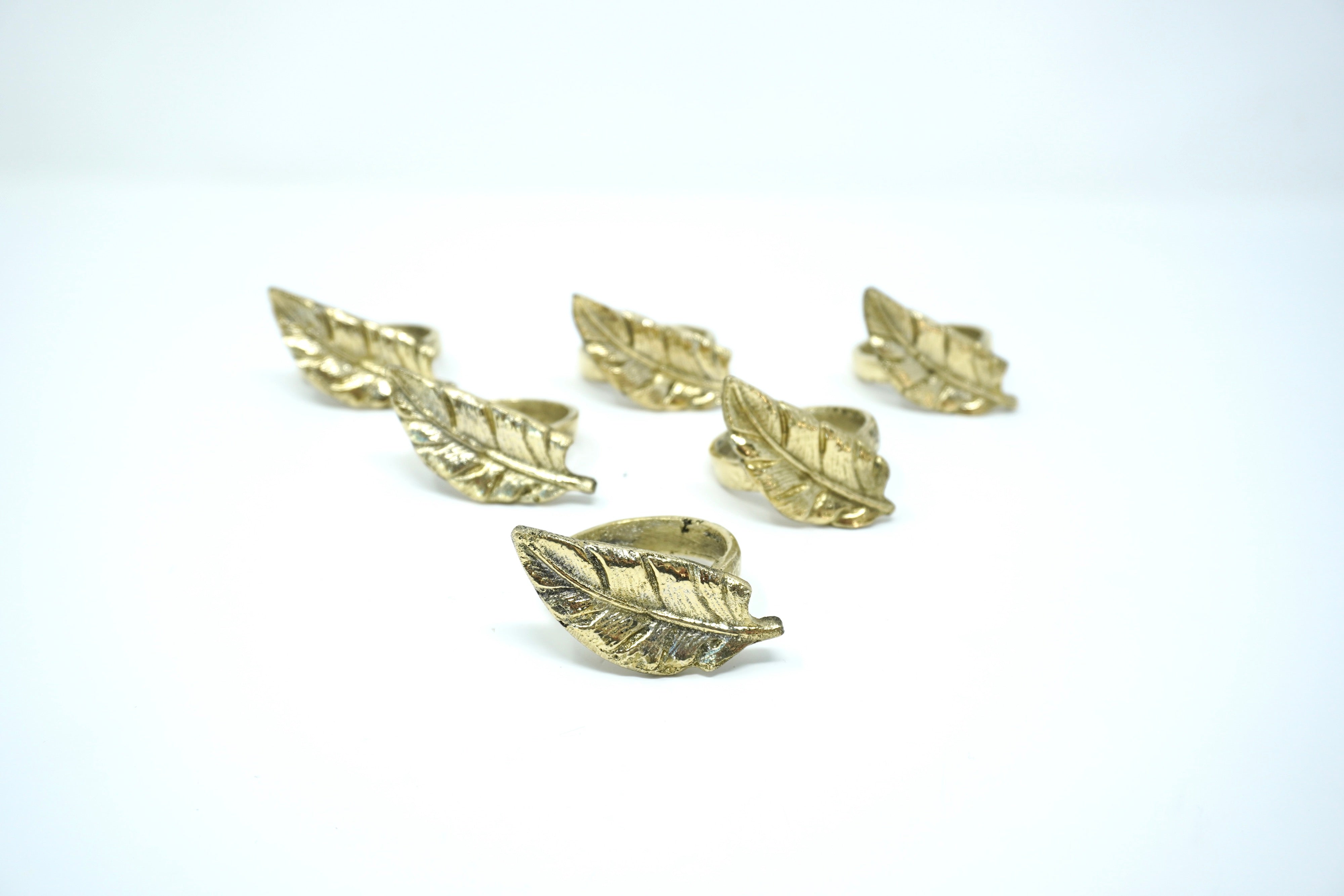 Servilleteros de Bronce Pluma Dorada 6 Piezas